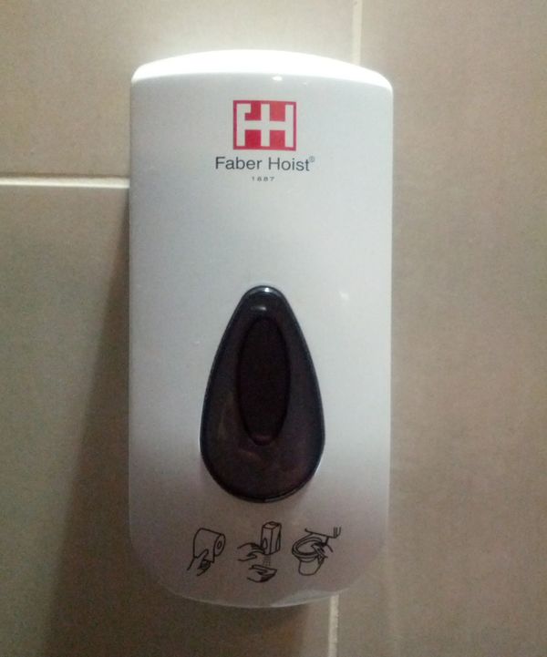 Sanitizer dispenser in the toilet